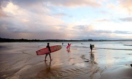 Evening mood with surfers at Watego Beach near Cape Byron, New South Wales