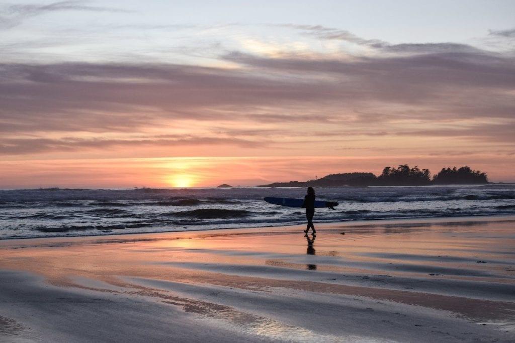 Watching the sunset while surfing in Tofino.